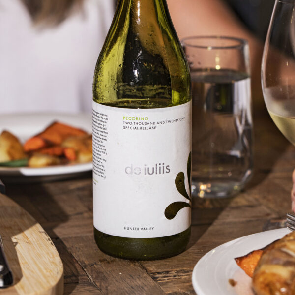 A bottle of De Iuliis 2021 Pecorino being enjoyed with a meal