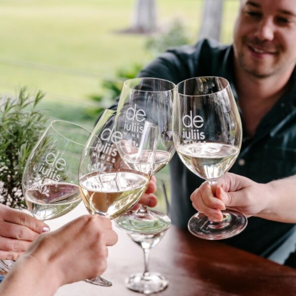 Cellar door guests at the De Iuliis Hunter Valley winery celebrate with a glass of premium wine