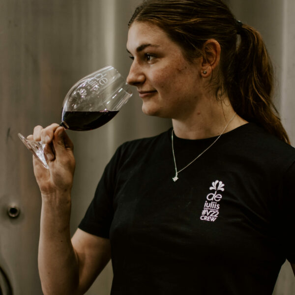 Hunter Valley Winemaker Emily holds a glass of De Iuliis shiraz