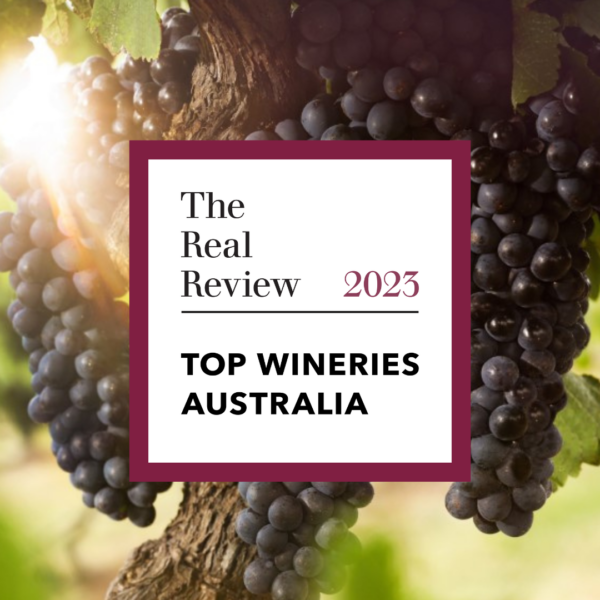 A logo for the Top Wineries of Australia in 2023. In the background is shiraz grapes.